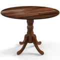 Table de salle à manger en bois avec plateau rond et pieds en tréteaux incurvés