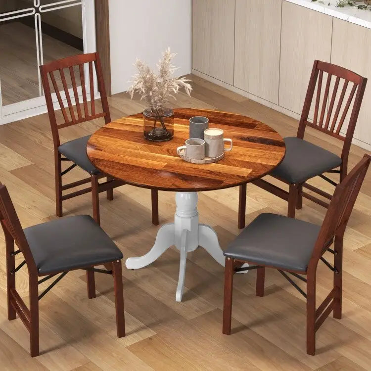 Table de salle à manger en bois avec plateau rond et pieds en tréteaux incurvés