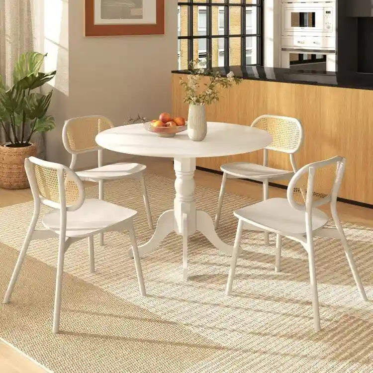 Table de salle à manger en bois avec plateau rond et pieds en tréteaux incurvés