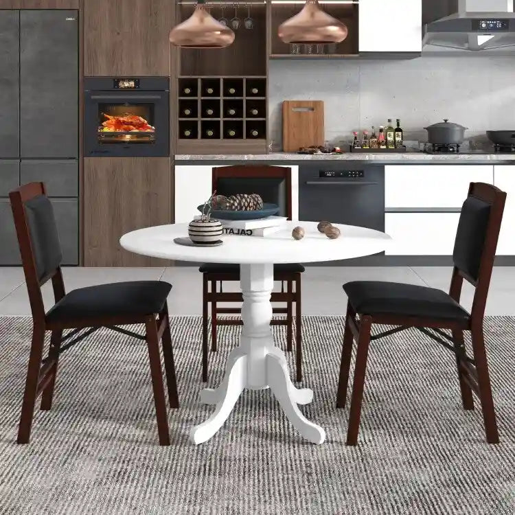Table de salle à manger en bois avec plateau rond et pieds en tréteaux incurvés