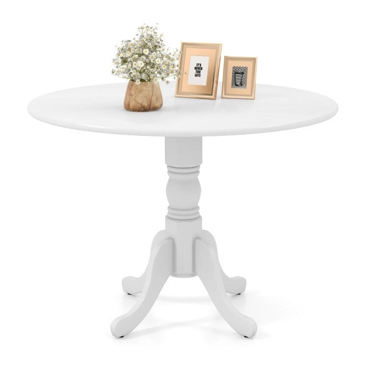Table de salle à manger en bois avec plateau rond et pieds en tréteaux incurvés