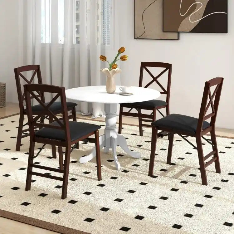 Table de salle à manger en bois avec plateau rond et pieds en tréteaux incurvés
