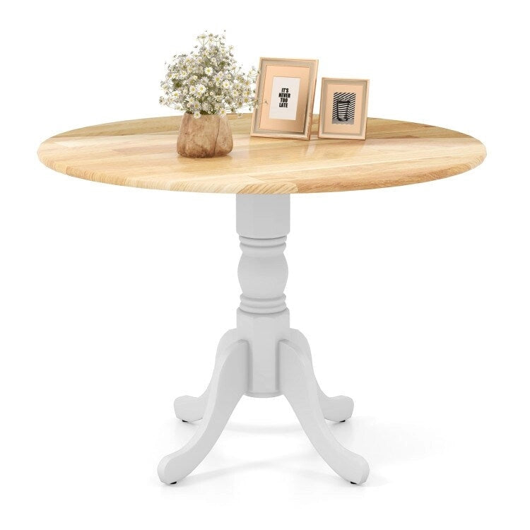 Table de salle à manger en bois avec plateau rond et pieds en tréteaux incurvés