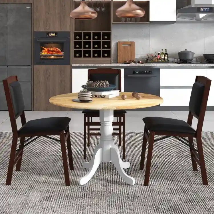 Table de salle à manger en bois avec plateau rond et pieds en tréteaux incurvés