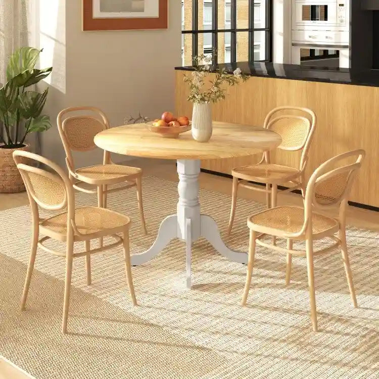 Table de salle à manger en bois avec plateau rond et pieds en tréteaux incurvés
